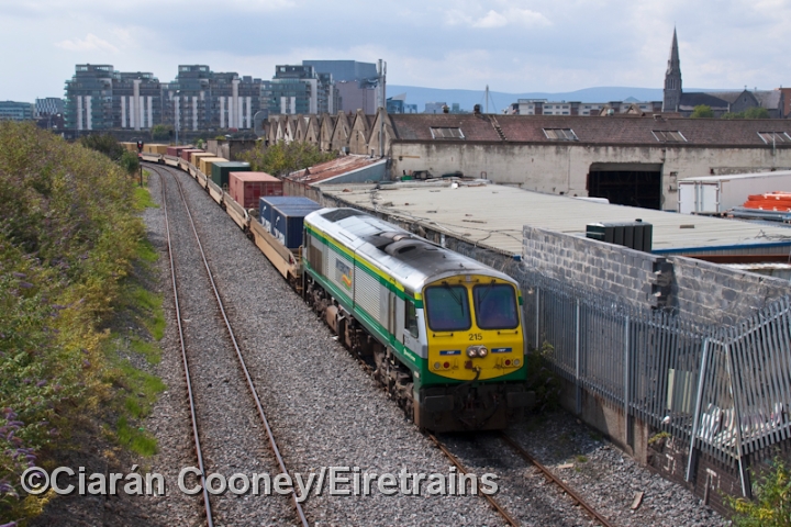 215_20110714_001_CC_JA.jpg - Having been involved in the opening ceremony for the new Ocean Pier container terminal at Dublin Port, No.215 is seen complete with IWT stickers as it heads the Ballina bound liner past Ossory Rd, Dublin City.